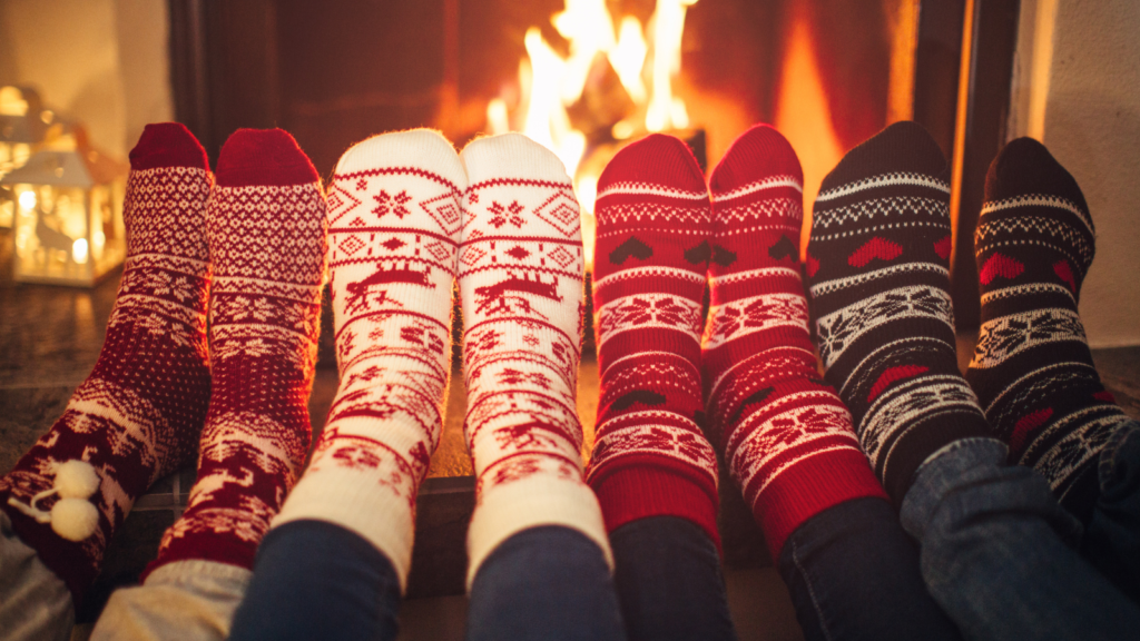 stocking feet in front of a roaring fire in the fireplace